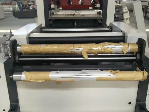 Automatic Folding and Flattening System for Roll Paper Materials